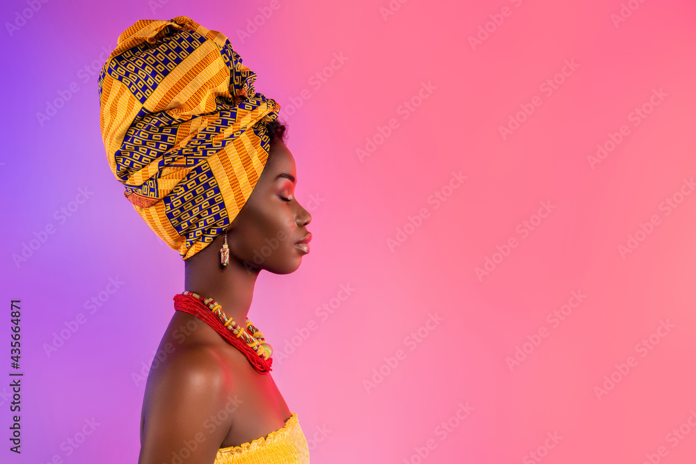 Profile side photo of stunning afro american lady look empty space wear traditional outfit isolated on glow background - obrazy, fototapety, plakaty 