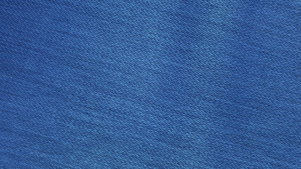 Wall Mural - blue woolen fabric texture background. bright blue clothing background. jeans texture with blank space for design.