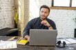 © Vadim Pastuh - Smart and clever multiracial male entrepreneur thinks about way to develop his startup, thoughtful intelligent hindu man in smart casual wear using laptop in modern loft office space