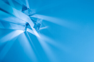Wall Mural - Glass prisms and cubes with color spectrum rays. Abstract background with reflection and refraction of light. Shadow and rays of natural light effects..