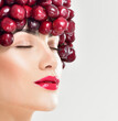 © Svetlana Fedoseeva - Beautiful woman in hat of red berries. Juicy cherries.