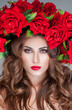 © Svetlana Fedoseeva - beautiful woman with red roses  Professional makeup. fashion model with large hairstyle and flowers in her hair.