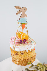 Wall Mural - Easter cake with decorative wooden ornament in the form of a rabbit