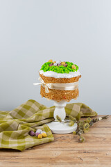 Wall Mural - Easter cake made from yeast dough, decorated with edible moss with a nest