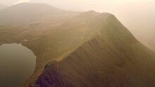 Dramatic Aerial Footage Showing Impressive Mountain Ridge Striding Edge On Helvellyn In The Lake District, UK.