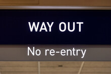 Posted Sign Above The Hallway Read "WAY OUT" And "no Re-entry"