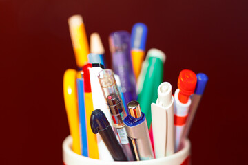 Pens for school in a pile . Stack of colorful pens