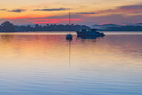 Fototapeta Pomosty - Sunrise waterscape with boats, light cloud and fog