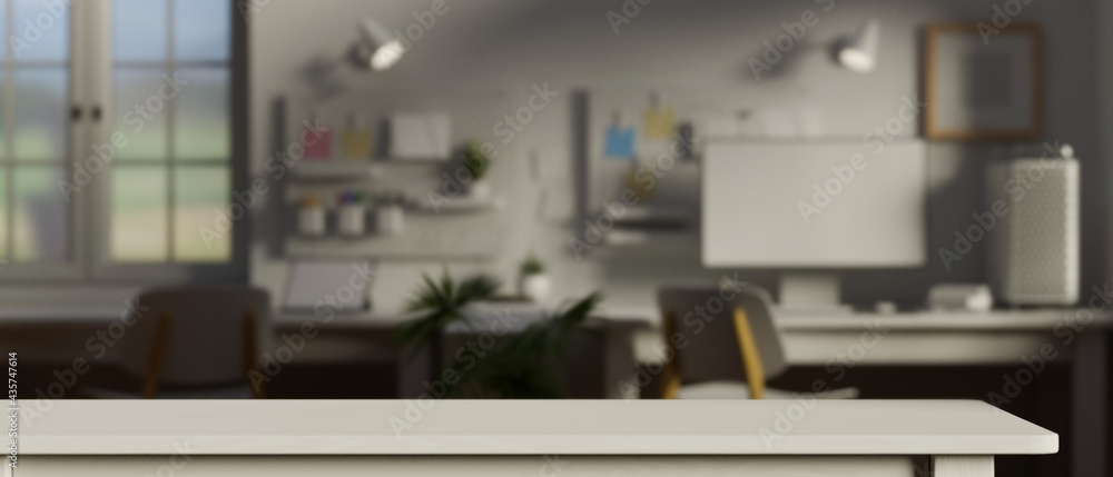 Empty white table in the office room with supplies and computer device ...
