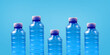 Plastic bottles on a blue background. The topic of plastic segregation and ecology in the world. Environmental protection banner. Place for text.