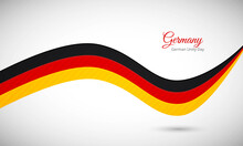 Happy German Unity Day Of Germany. Creative Shiny Wavy Flag Background With Text Typography.