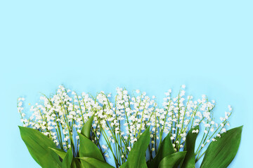 spring flowers lilies of the valley on a blue background