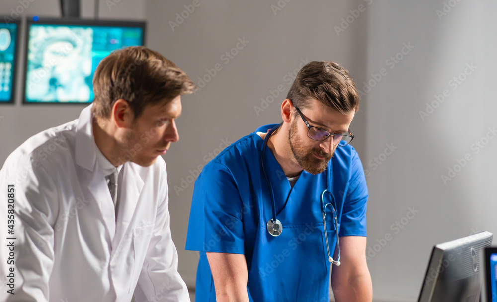 Professional medical doctors working in hospital office using computer technology. Medicine, neurosurgery and healthcare. - obrazy, fototapety, plakaty 