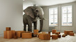 Starker Elefant mit Umzugskartons beim Umzug im Raum