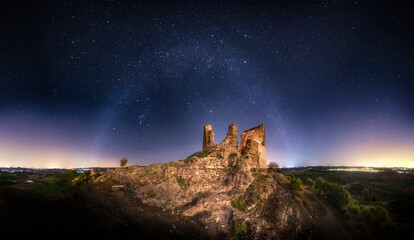 A look into another time. Beautiful panoramic view of the winter milky way with its constellations over a  medieval castle. Night landscape, the arch of the Milky Way over a castle. Turis, Valencia