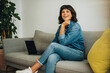 © Jacob Lund - Cheerful freelancer in office lobby