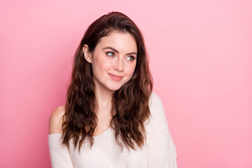 Poster - Portrait of adorable glad girl smile look empty space thinking wear pullover isolated on pink color background