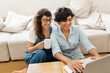 © (JLco) Julia Amaral - Lesbian couple at home with laptop