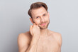 © deagreez - Photo of shirtless blond hairdo guy touch beard without clothes isolated on grey color background