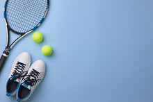 Tennis Racket And Shoes On Blue Background