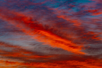 Wall Mural - Red clouds at sunset. Beautiful fiery sky, texture background 