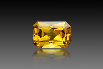 Golden yellow color natural heliodor beryl emerald cut, shaped loose gemstone setting for making jewelry. Eye clean, transparent with some small inclusions stone on black gradient background. Blur