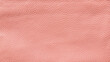 Close-up of detailed pink faux leather surface. High resolution full frame textured background.