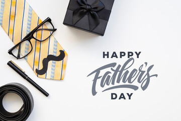 Flat lay with men's accessories and happy father's day greeting lettering text