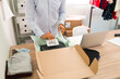 © AntonioDiaz - Entrepreneur putting a lovely note on a package