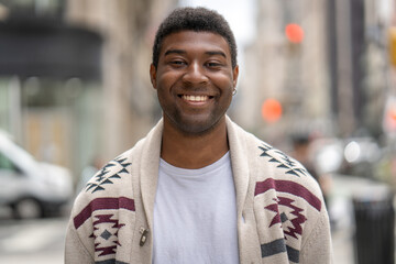 Wall Mural - Young black man in city walking street smile happy face