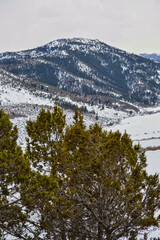 Sticker - Beautiful view of a snow-covered mountainous landscape under a cloudy sky