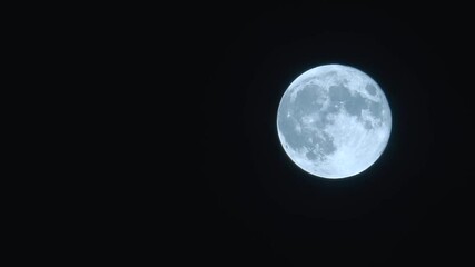 super moon in dark sky. full moon at night with copy space from left.