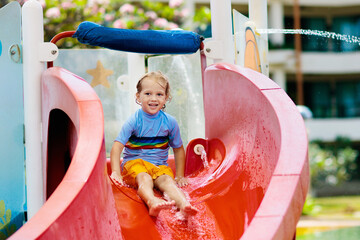 Canvas Print - Kids on water slide in aqua park. Summer vacation