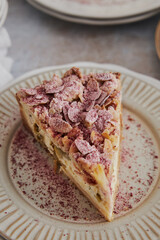 Wall Mural - Top view of delicious rhubarb cheese pie on a plate on a white table