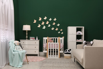 Poster - Beautiful baby room interior with stylish furniture and comfortable crib