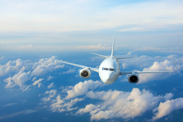 Passenger plane, business trip, travel concept. Flying evening before sunset.