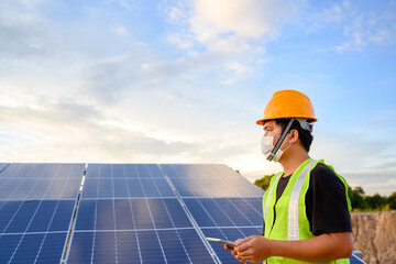 Wall Mural - Solar panels of a solar power station at a photovoltaic power station Engineers working on the inspection and maintenance of solar energy equipment in the industry.