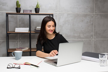 Young woman working at the office