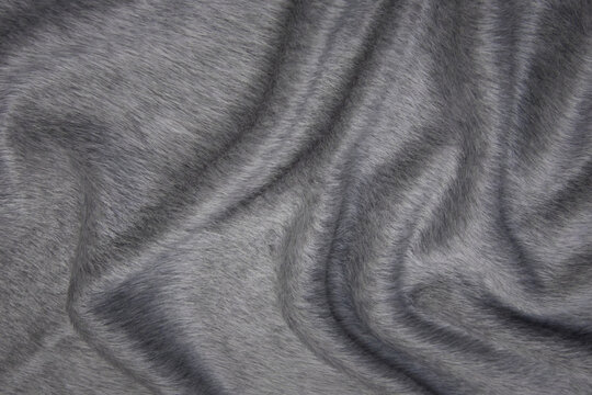 Wall Mural -  - Close up texture of fabric for coat. Gray woolen fabric. Gray background.