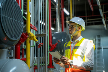 Aufkleber - Technician engineer checking controls system for security functions in service room at factory,Heating,Ventilation,Air Conditioning.