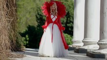 Red Queen Is Walking In Garden Of Royal Castle, Fairytale Art Shot