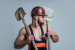 build and construction. sexy man with shovel. professional constructor or mechanic. builder engineer. muscular man architect with strong body. guy wear worker uniform. athletic builder in helmet