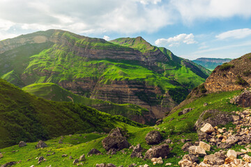 Wall Mural - Green mountains and blue clouds landscape