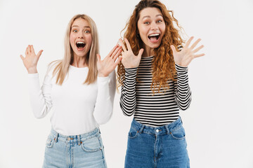 Wall Mural - Young two women screaming and gesturing at camera