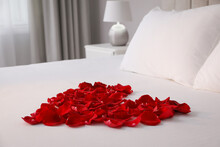 Beautiful Heart Of Red Rose Petals On Bed In Room