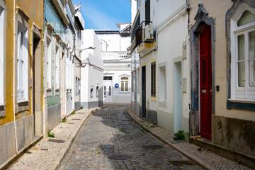 Sticker - Narrow street of historic fishermen's town of Olhao, Algarve, Portugal