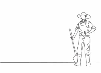 Wall Mural - Continuous one line drawing of young male farmer pose standing on field and holding shovel . Professional job profession minimalist concept. Single line draw design vector graphic illustration