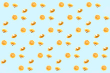 Bright Colorful Repetitive Pattern Made Of Lemon Pieces On Blue Background. Minimal Abstract Concept Flatlay .