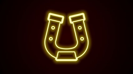 Sticker - Glowing neon line Horseshoe icon isolated on black background. 4K Video motion graphic animation