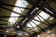 Interior of industrial roof rafters with dramatic light and shadow
